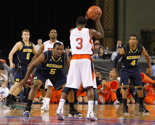 Zack Novak (0), Eso Akunne (5), and Darius Morris (4)