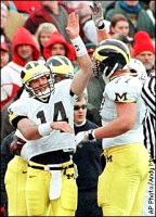 Brian Griese (14) and Jon Jansen (77)
