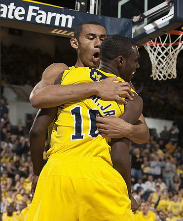 Jon Horford (15) and Tim Hardaway Jr. (10)
