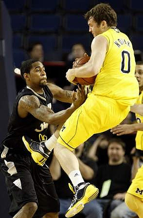 Zack Novak (0) and Jordan Morgan (52)