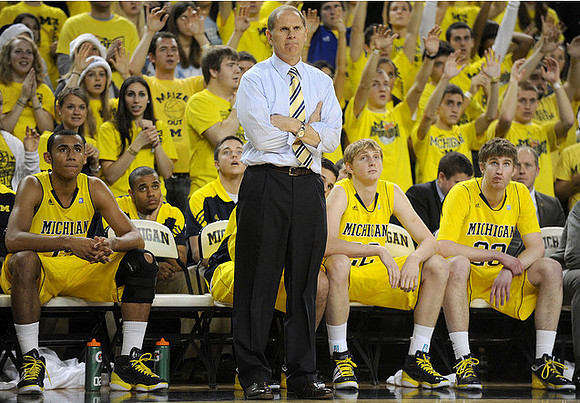 Jon Horford (15), John Beilein, Blake McLimans (22), and Evan Smotrycz (23)
