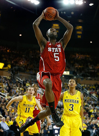 Nik Stauskas (11) and Trey Burke (3)
