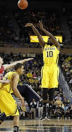 Jordan Morgan (52) and Tim Hardaway Jr. (10)