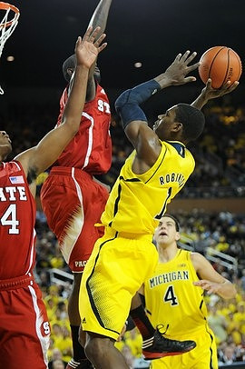 Glenn Robinson III (1) and Mitch McGary (4)