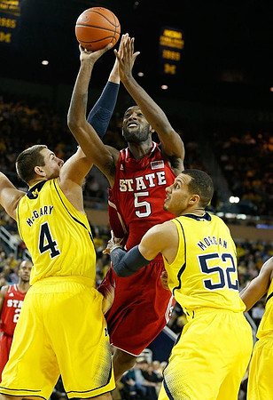Mitch McGary (4) and Jordan Morgan (52)