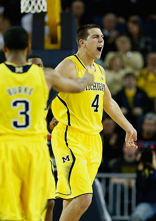 Trey Burke (3) and Mitch McGary (4)