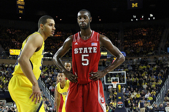 Jordan Morgan (52) and Trey Burke (3)