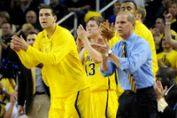 Mitch McGary (4), Matt Vogrich (13), Jon Horford (15), and John Beilein