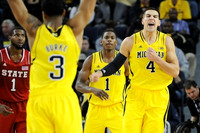 Trey Burke (3), Glenn Robinson III (1), and Mitch McGary (4)