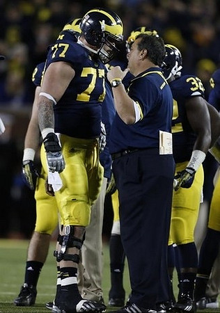 Taylor Lewan (77), Brady Hoke, and De'Veon Smith