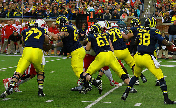 Taylor Lewan (77), Kyle Bosch (65), Graham Glasgow (61), Erik Magnuson (78), Michael Schofield (75), and Devin Gardner (98)