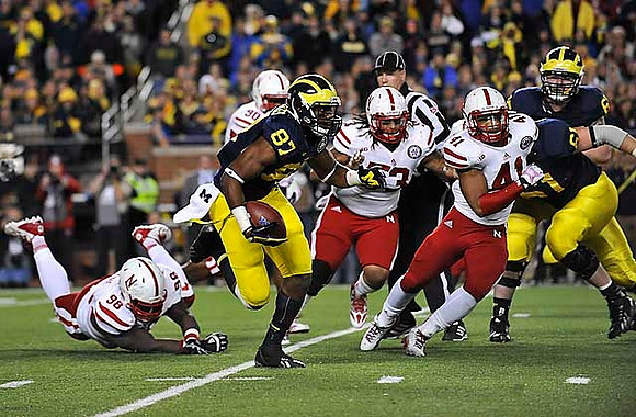 Devin Funchess (87), Graham Glasgow (61), and Kyle Bosch (65)