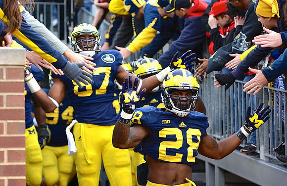 Fitzgerald Toussaint (28) and Devin Funchess (87)