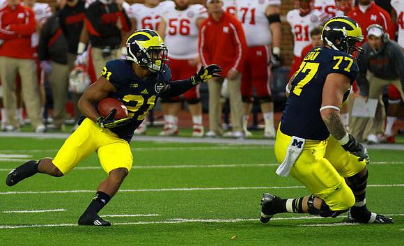 Jeremy Gallon (21) and Taylor Lewan (77)