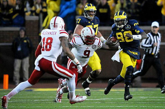 Taylor Lewan (77) and Devin Gardner (98)