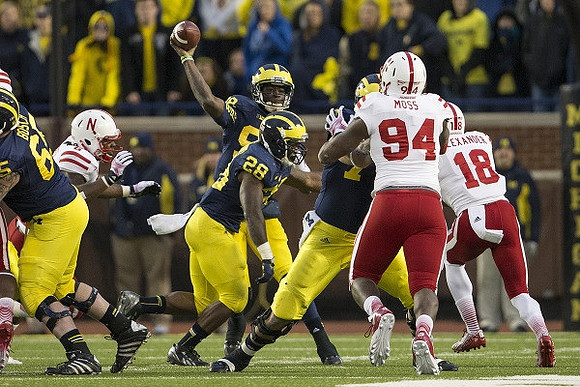 Kyle Bosch (65), Fitzgerald Toussaint (28), and Devin Gardner (98)