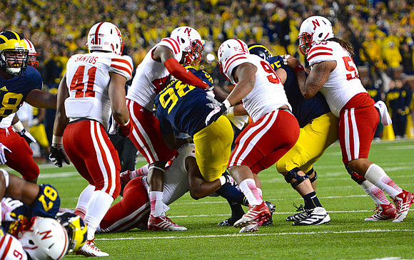 Jake Butt (88), Devin Funchess (87), Devin Gardner (98), and Michael Schofield (75)