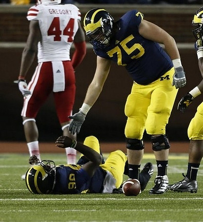 Devin Gardner (98) and Michael Schofield (75)