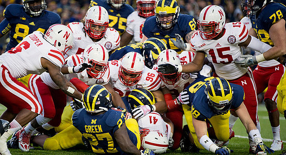 A.J. Williams (84), Derrick Green (27), Michael Schofield (75), Kyle Bosch (65), Jake Butt (88), and Erik Magnuson (78)