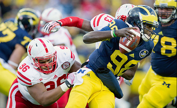 Taylor Lewan (77), Devin Gardner (98), and Erik Magnuson (78)