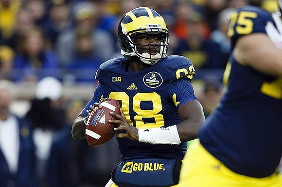 Devin Gardner (98) and Michael Schofield (75)