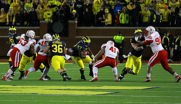 Devin Gardner (98), Joe Kerridge (36), Derrick Green (27), and Taylor Lewan (77)