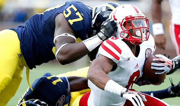 Frank Clark (57) and Courtney Avery (11)