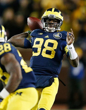 Fitzgerald Toussaint (28) and Devin Gardner (98)