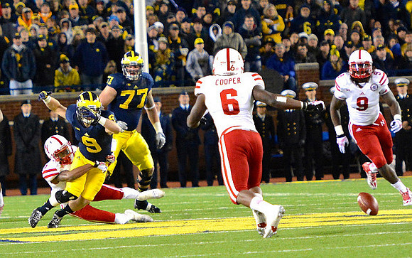 Drew Dileo (9) and Taylor Lewan (77)