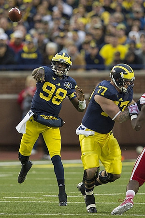 Devin Gardner (98) and Taylor Lewan (77)