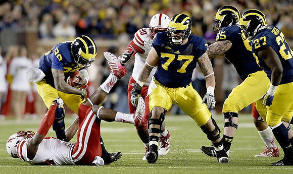 Devin Gardner (98), Taylor Lewan (77), Kyle Bosch (65), and Derrick Green (27)