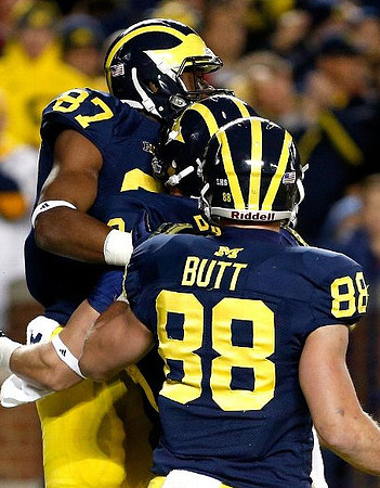 Devin Funchess (87), Drew Dileo (9), and Jake Butt (88)
