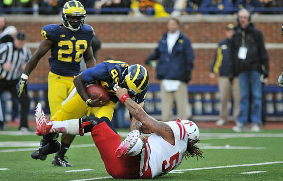 Fitzgerald Toussaint (28) and Devin Gardner (98)