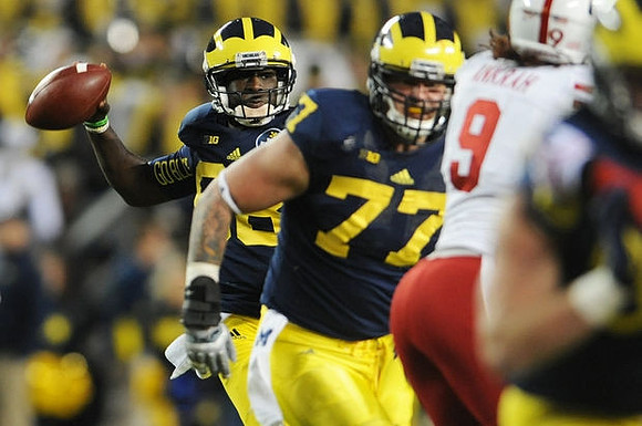 Devin Gardner (98) and Taylor Lewan (77)