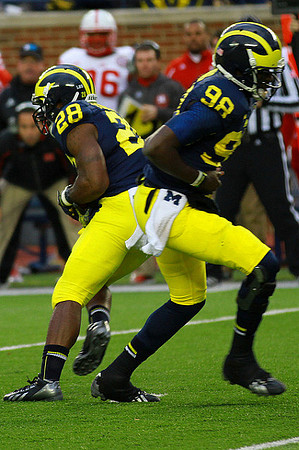 Fitzgerald Toussaint (28) and Devin Gardner (98)