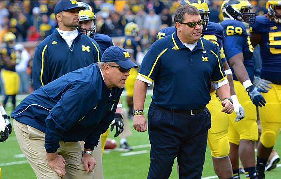 Brady Hoke and Willie Henry (69)
