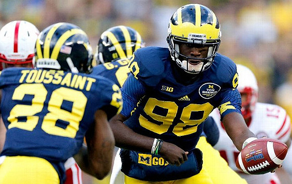 Fitzgerald Toussaint (28), Graham Glasgow (61), and Devin Gardner (98)