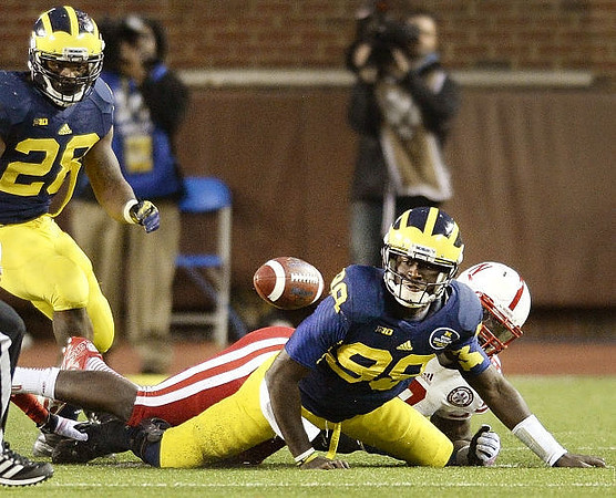 Fitzgerald Toussaint (28) and Devin Gardner (98)