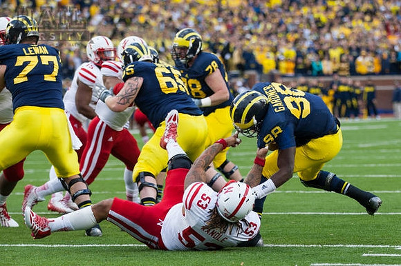 Taylor Lewan (77), Kyle Bosch (65), Erik Magnuson (78), and Devin Gardner (98)