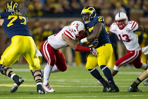 Taylor Lewan (77) and Derrick Green (27)