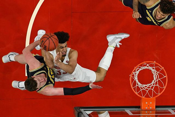 Jon Teske (15) and Isaiah Livers (2)