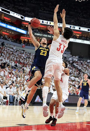Brandon Johns Jr. (23) and Jon Teske (15)