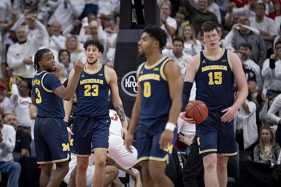 Zavier Simpson (3), Brandon Johns Jr. (23), David DeJulius (0), and Jon Teske (15)