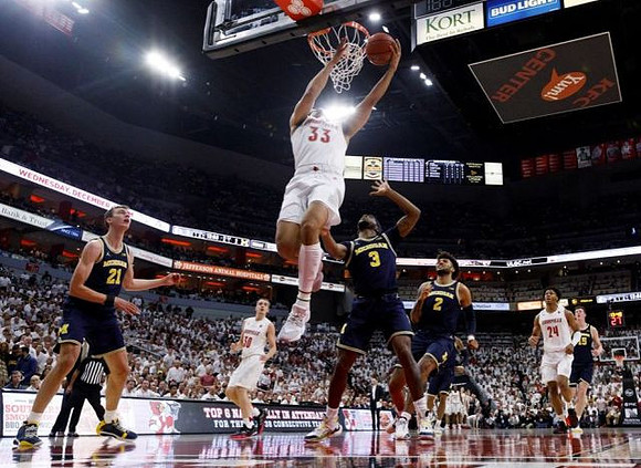 Franz Wagner (21), Zavier Simpson (3), Isaiah Livers (2), and Jon Teske (15)