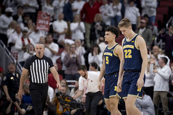 Adrien Nunez (5) and Cole Bajema (22)