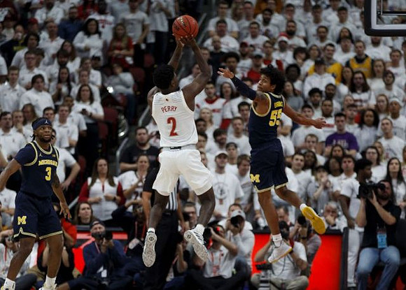 Zavier Simpson (3) and Eli Brooks (55)