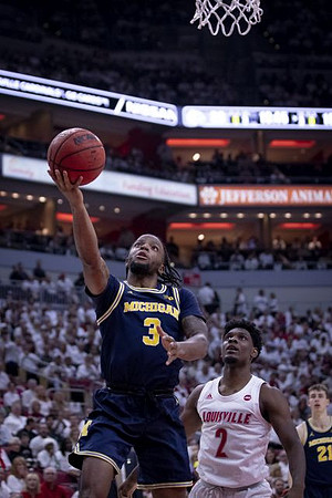 Zavier Simpson (3) and Franz Wagner (21)