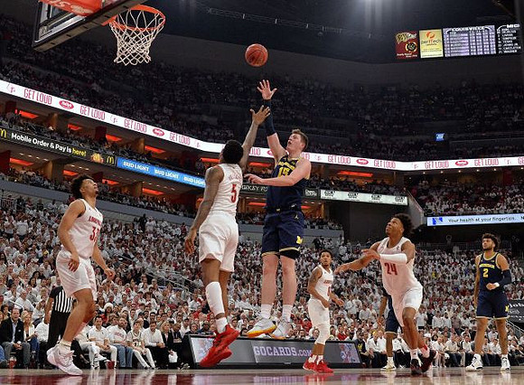 Jon Teske (15) and Isaiah Livers (2)