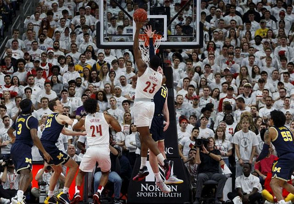 Zavier Simpson (3), Franz Wagner (21), Jon Teske (15), and Eli Brooks (55)