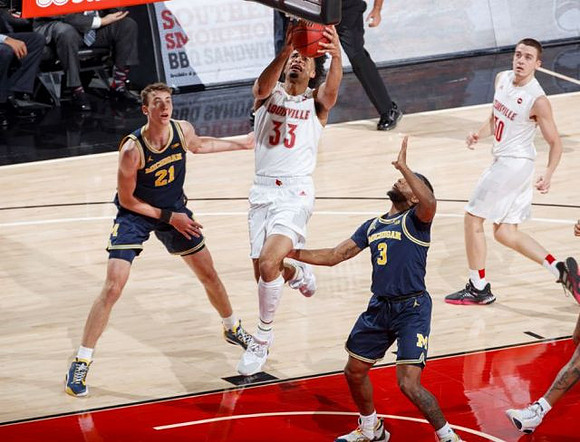 Franz Wagner (21) and Zavier Simpson (3)